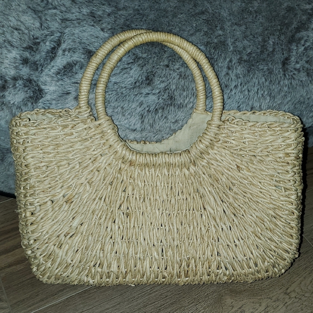 Elegant Tan Woven Handbag. Inside zip. Inside pocket.
